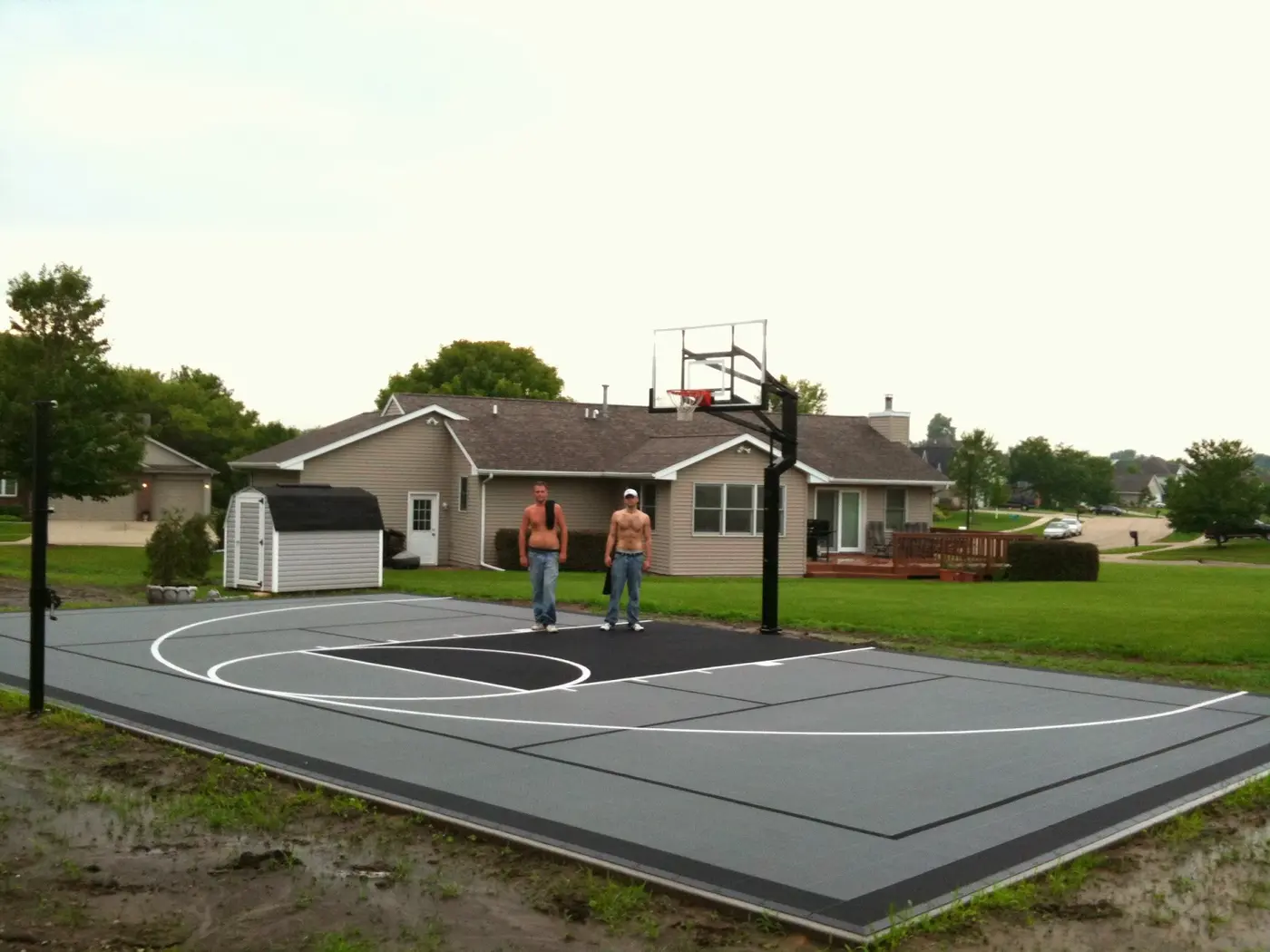 Gray and black Backyard Sports Center basketball court freshly installed