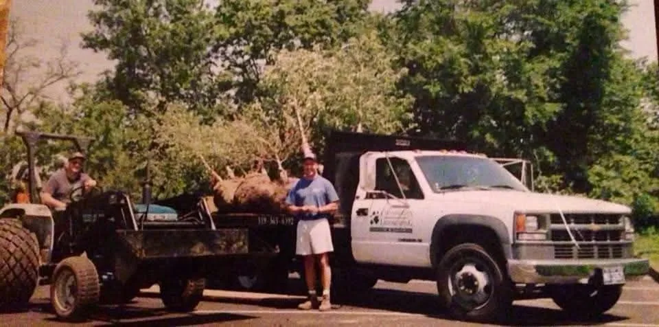Darin Chamberlin with buddy Mark planting trees in 1995 — the early days of Chamberlin Landscaping