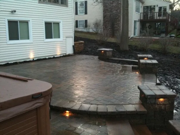 Patio step lighting and outdoor living space illumination — night lighting installation by Landforms Design Inc Cedar Rapids Iowa 2009