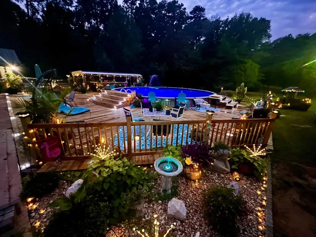 Deck step LED lighting with colorful accent illumination — night lighting installation by Landforms Design Inc Cedar Rapids Iowa 2023