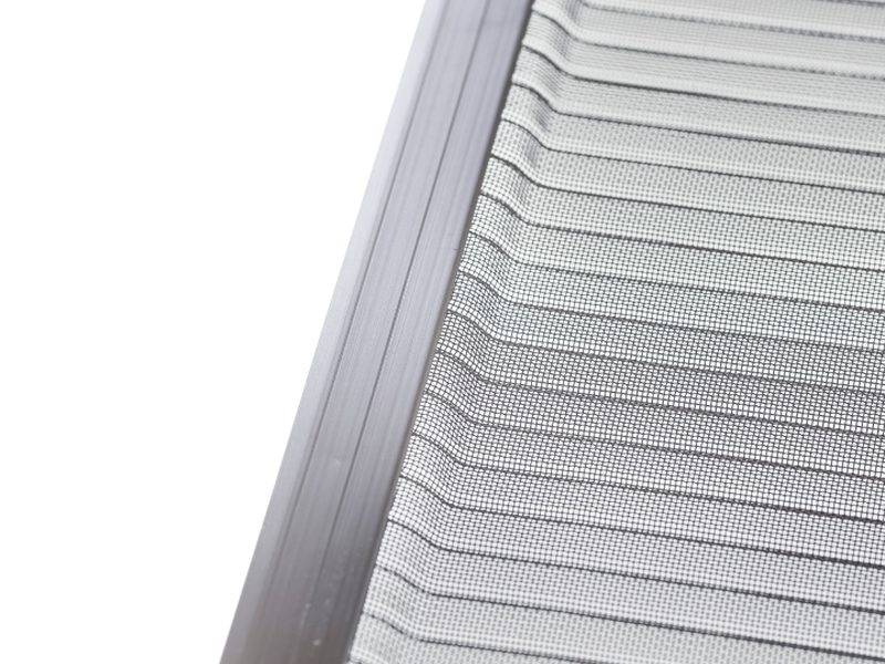 Close-up of a stainless steel micro-mesh gutter guard panel with raised ribs